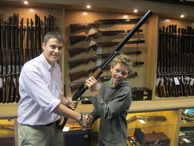Cosmo receiving the .410 from Chris Sugden at Ian Coley Gunshop